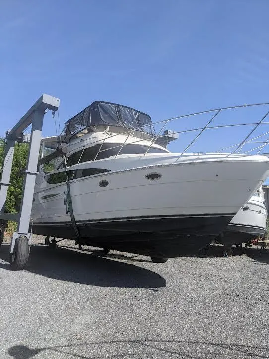 Slide: The Image of 2005 Meridian 459 Motoryacht on dry dock under clear blue sky. - 6