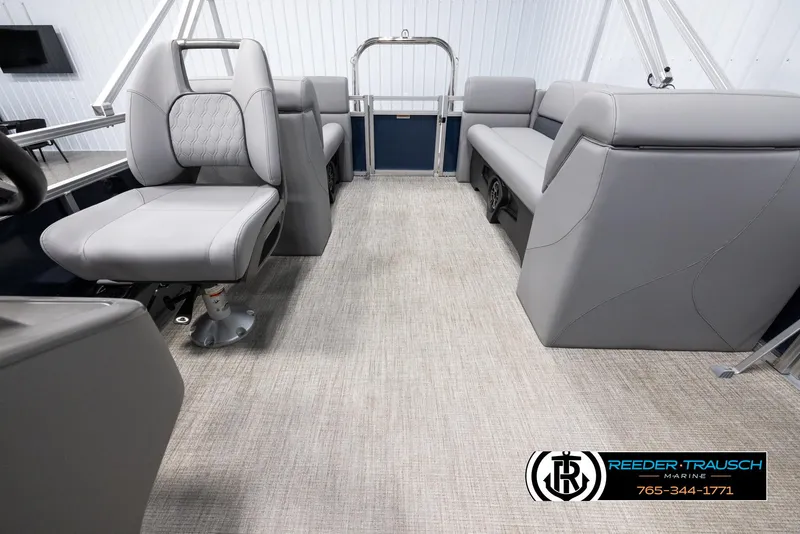 Slide: The Image of 2025 Avalon VLS QL boat interior with gray seating and carpet flooring. - 14