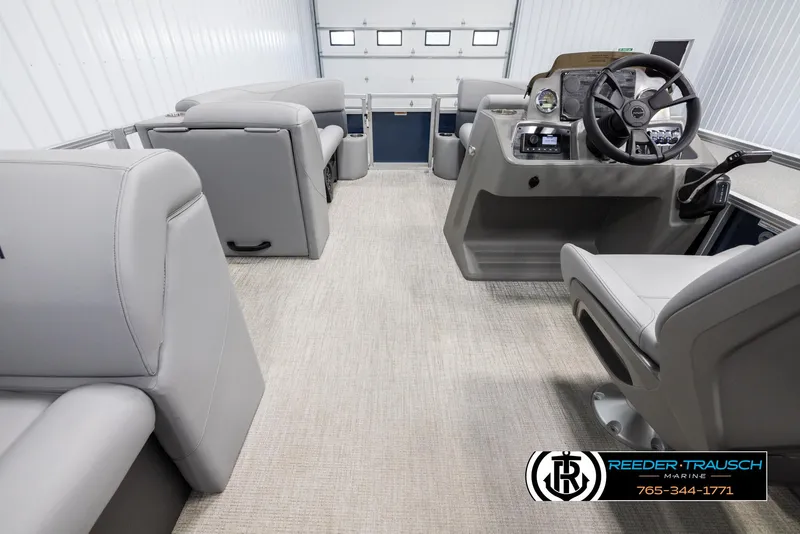 Slide: The Image of 2025 Avalon VLS QL boat interior with gray seating and modern dashboard. - 17