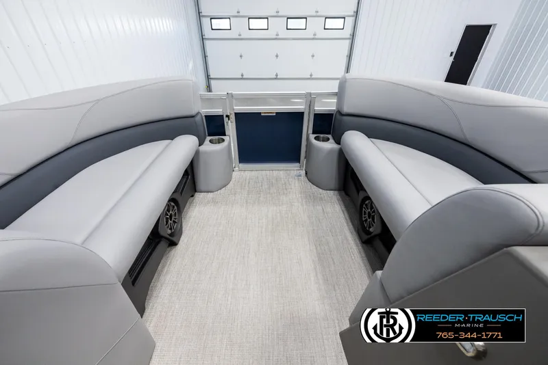 Slide: The Image of 2025 Avalon VLS QL boat interior with gray seating and carpeted floor. - 18