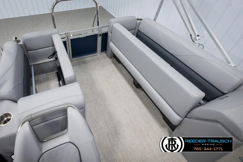 Slide: The Image of 2025 Avalon VLS QL boat interior with gray seating and carpeted floor. - 23