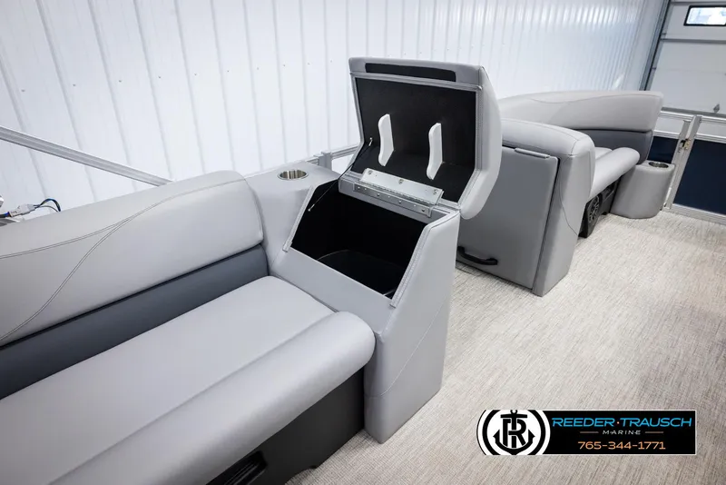 Slide: The Image of Avalon VLS QL 2025 boat interior with gray seating and storage compartment. - 25