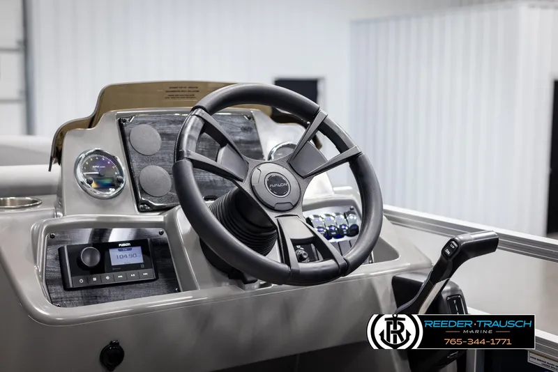 Slide: The Image of 2025 Avalon VLS QL boat dashboard with steering wheel and control panel. - 27