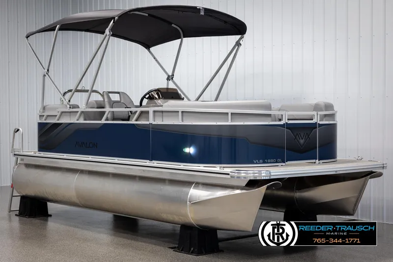 Slide: The Image of 2025 Avalon VLS QL pontoon boat with canopy in showroom. - 3