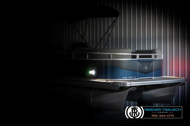 Slide: The Image of 2025 Avalon VLS QL pontoon boat in dimly lit showroom. - 4