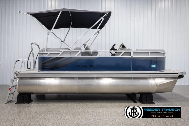 Slide: The Image of 2025 Avalon VLS QL pontoon boat with canopy in showroom. - 5