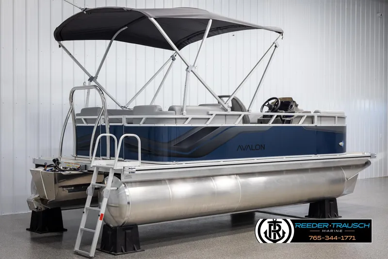 Slide: The Image of 2025 Avalon VLS QL pontoon boat with canopy in showroom. - 6