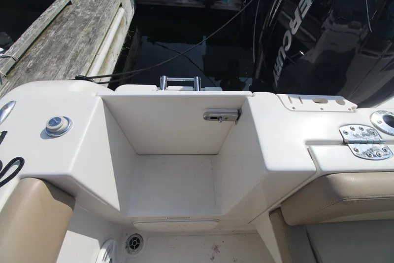 Slide: The Image of 2017 Sailfish 236 CC boat interior, featuring seating and deck details. - 25