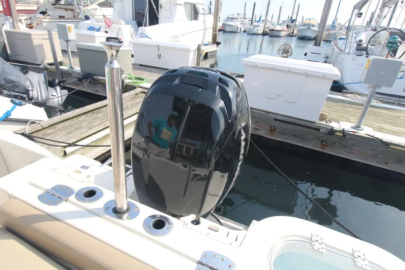 Slide: The Image of 2017 Sailfish 236 CC boat engine at marina dock. - 34