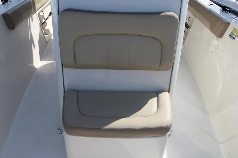 Slide: The Image of 2017 Sailfish 236 CC boat seat with beige cushions. - 8