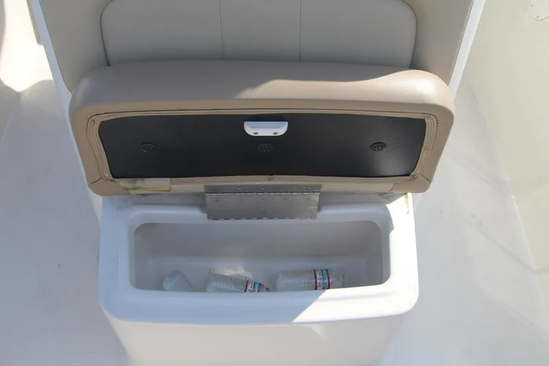Slide: The Image of 2017 Sailfish 236 CC boat cooler with open lid and water bottles inside. - 9