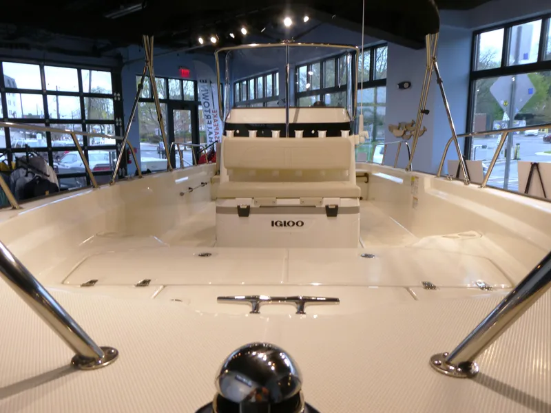 Slide: The Image of 2024 Boston Whaler 210 Montauk boat interior with seating and Igloo cooler. - 3