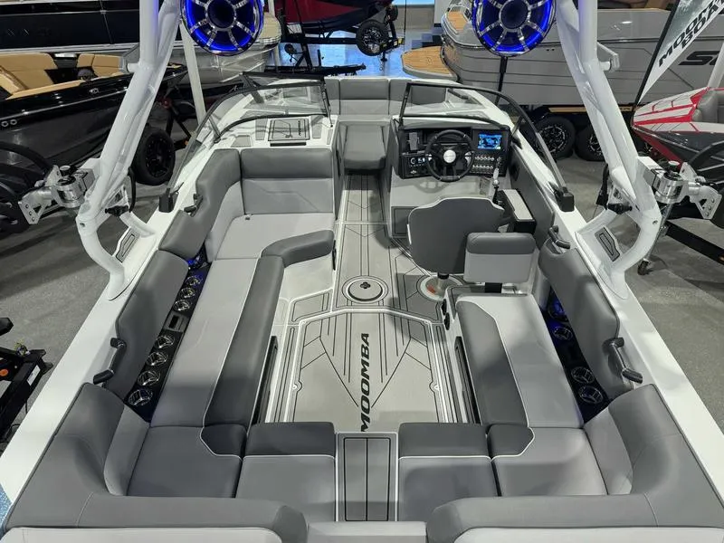 Slide: The Image of 2025 Moomba Max boat interior with sleek gray seating and advanced dashboard controls. - 1
