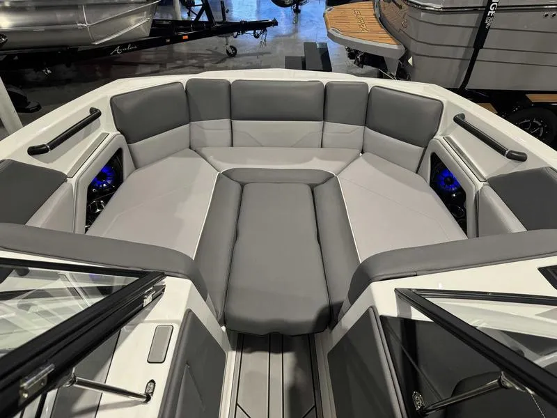 Slide: The Image of 2025 Moomba Max boat interior with gray seating and modern design. - 10