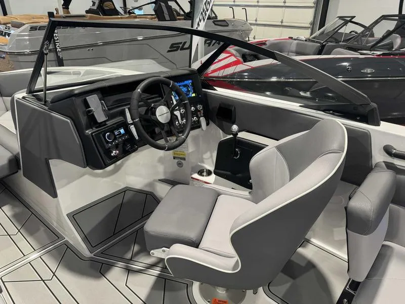 Slide: The Image of 2025 Moomba Max boat interior with modern dashboard and steering wheel. - 13