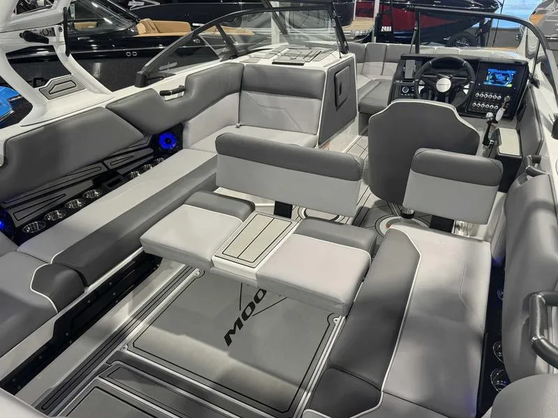Slide: The Image of 2025 Moomba Max boat interior with modern seating and advanced dashboard controls. - 3