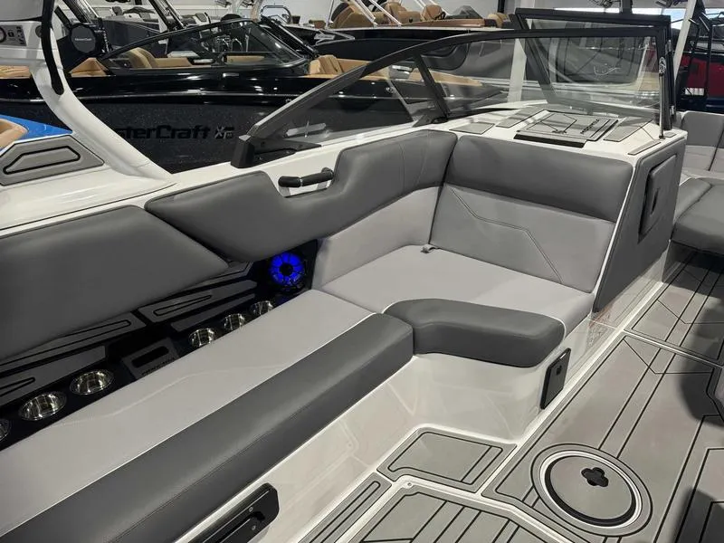Slide: The Image of 2025 Moomba Max boat interior with gray seating and modern design. - 9