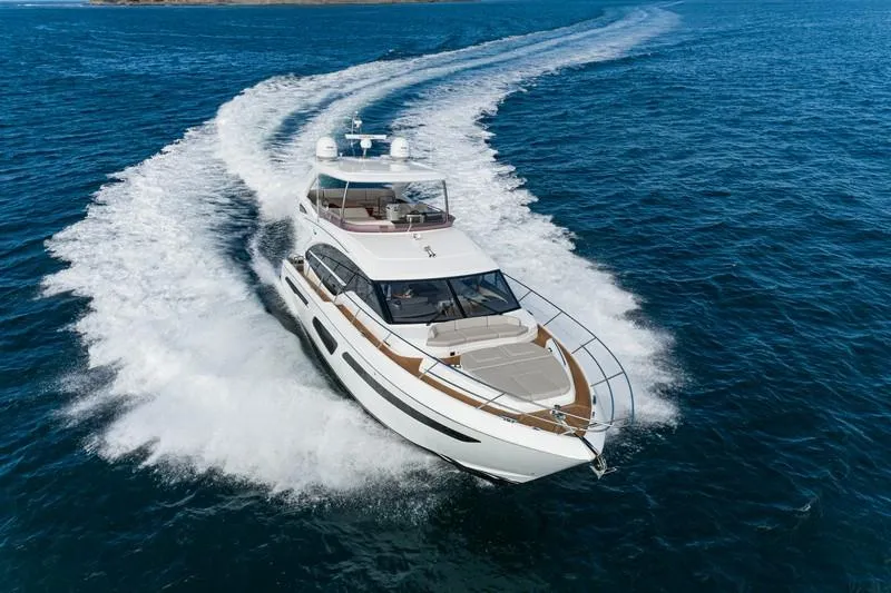 Slide: The Image of 2022 Princess F55 yacht cruising on open sea, creating a dynamic wake. - 14