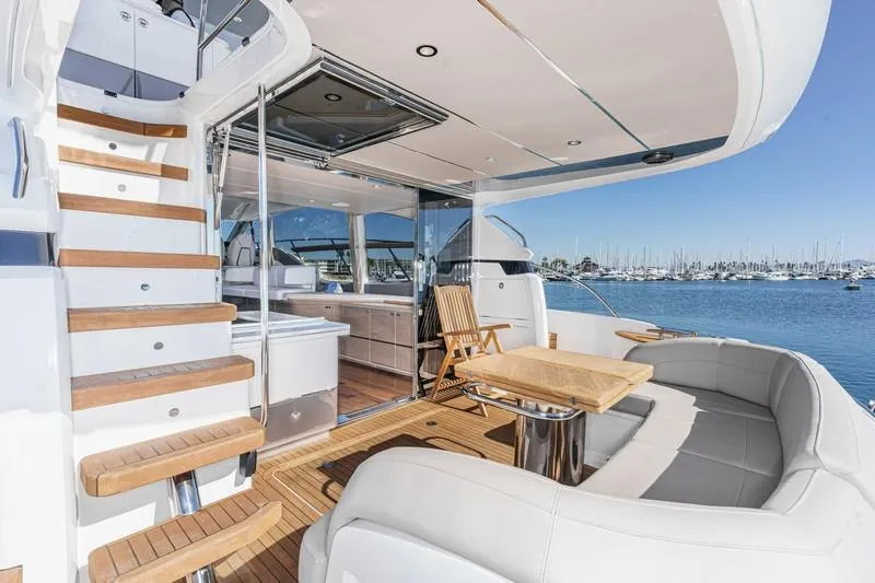 Slide: The Image of Luxurious 2022 Princess F55 yacht interior with elegant seating and scenic marina view. - 42