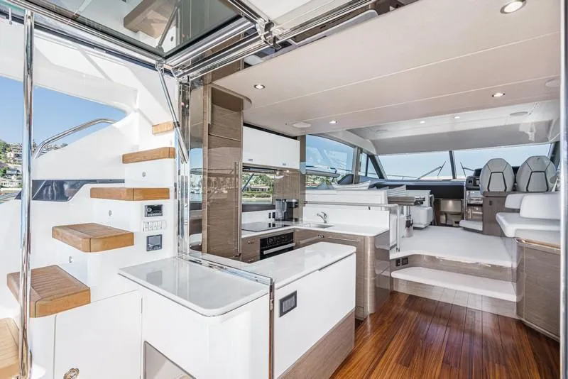 Slide: The Image of Luxurious interior of 2022 Princess F55 yacht with modern kitchen and seating area. - 44