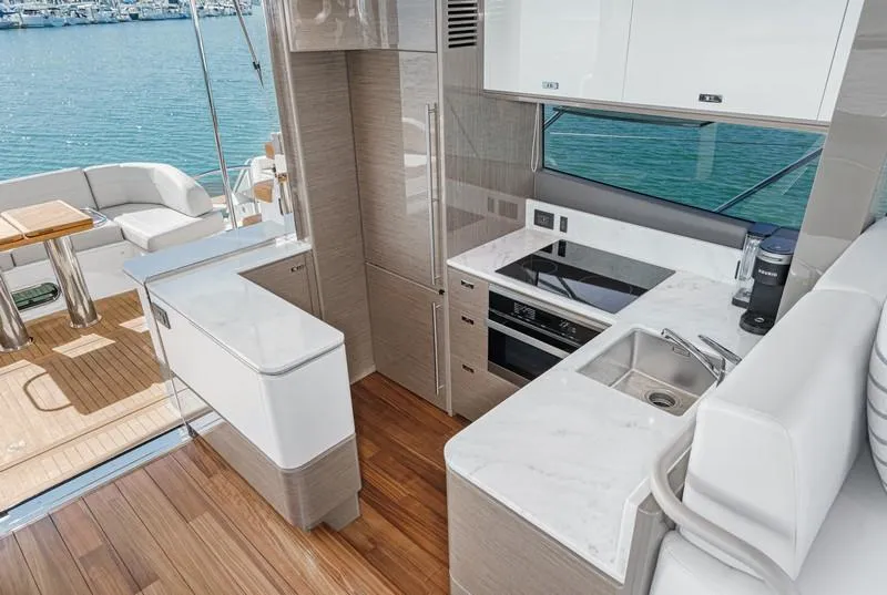 Slide: The Image of Luxurious 2022 Princess F55 yacht kitchen with modern appliances and elegant design. - 48