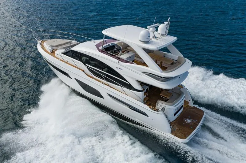 Slide: The Image of 2022 Princess F55 yacht cruising on open water, showcasing sleek design and luxury features. - 5