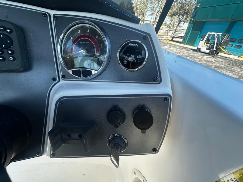 Slide: The Image of Dashboard of a 2022 Hurricane SS 192RL boat with gauges and controls. - 10