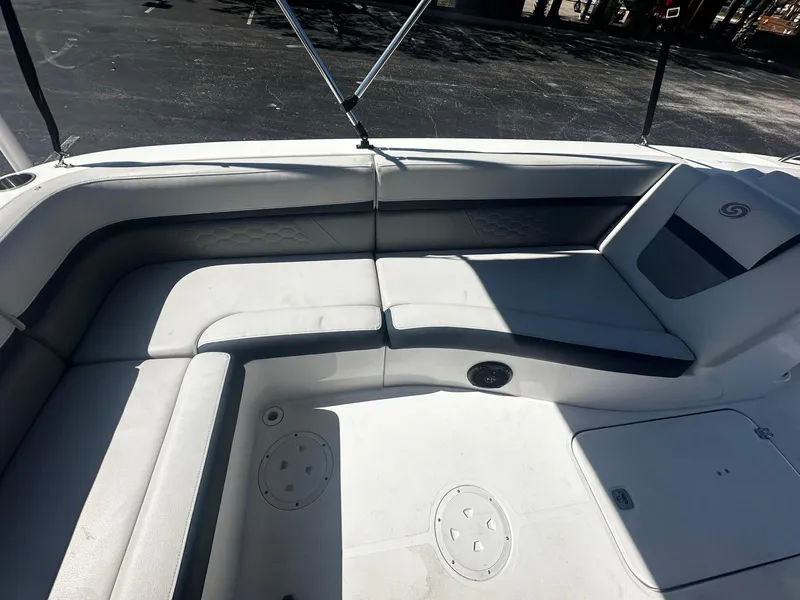 Slide: The Image of 2022 Hurricane SS 192RL boat interior with cushioned seating and storage compartments. - 7