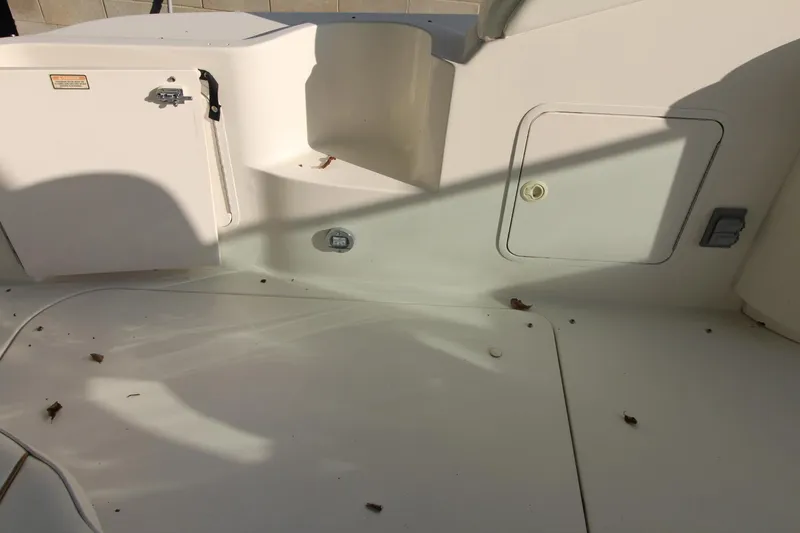 Slide: The Image of Deck area of a 2000 Sea Ray 340 Sundancer boat, showing storage compartments. - 16