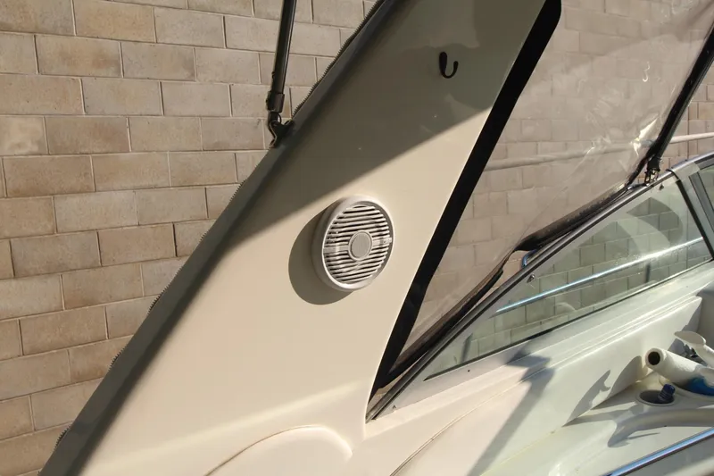 Slide: The Image of 2000 Sea Ray 340 Sundancer boat interior with speaker and windshield detail. - 20