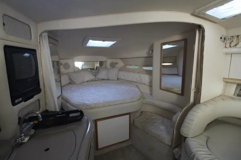 Slide: The Image of Interior cabin of 2000 Sea Ray 340 Sundancer with bed, seating, and skylight. - 22