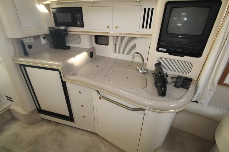 Slide: The Image of Interior of 2000 Sea Ray 340 Sundancer yacht with kitchenette and appliances. - 35
