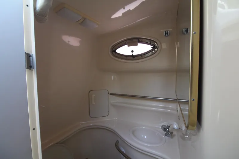 Slide: The Image of Interior of 2000 Sea Ray 340 Sundancer bathroom with sink and porthole window. - 39