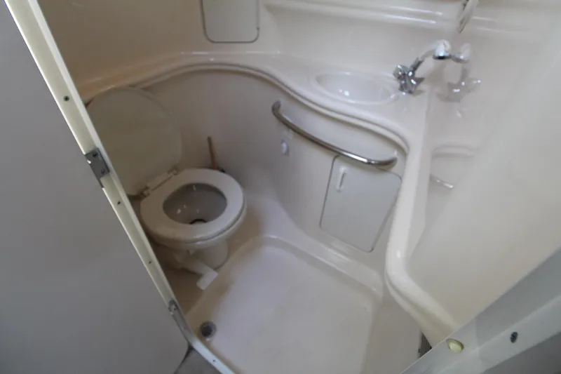 Slide: The Image of Bathroom interior of 2000 Sea Ray 340 Sundancer yacht, featuring toilet and sink. - 41