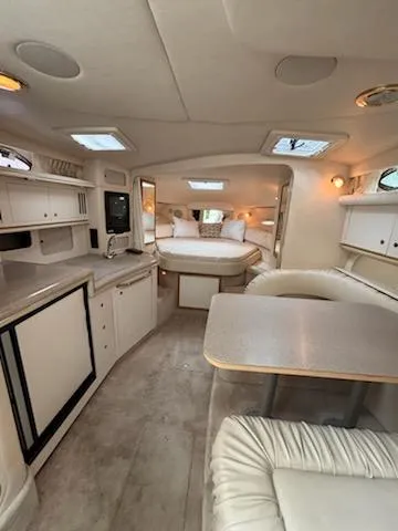 Slide: The Image of Interior of 2000 Sea Ray 340 Sundancer yacht with cozy seating and modern amenities. - 9