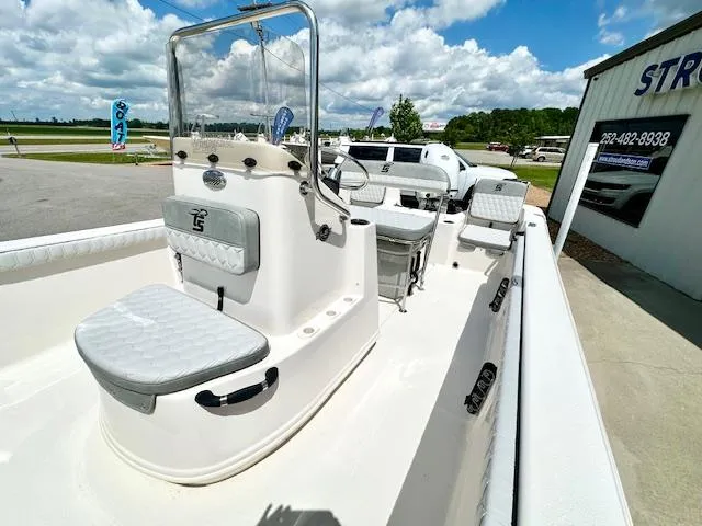 Slide: The Image of 2025 Carolina Skiff 19 LS boat with seating, console, and clear skies. - 15