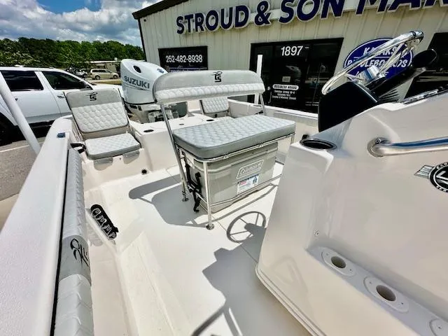 Slide: The Image of 2025 Carolina Skiff 19 LS boat interior with seating and Suzuki engine at Stroud & Son Marine. - 17