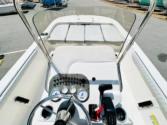 Slide: The Image of 2025 Carolina Skiff 19 LS boat interior with steering console and seating area. - 18