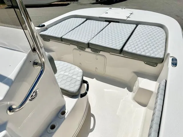 Slide: The Image of 2025 Carolina Skiff 19 LS boat interior with cushioned seating and console. - 3