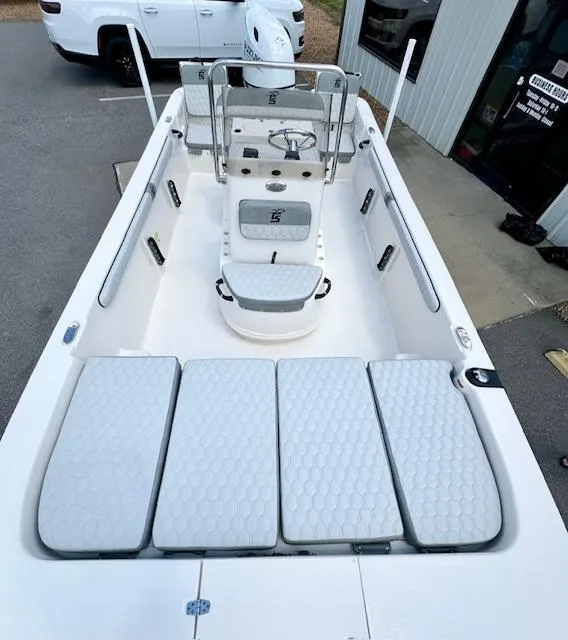Slide: The Image of 2025 Carolina Skiff 19 LS boat, spacious interior, modern design, parked outdoors. - 9