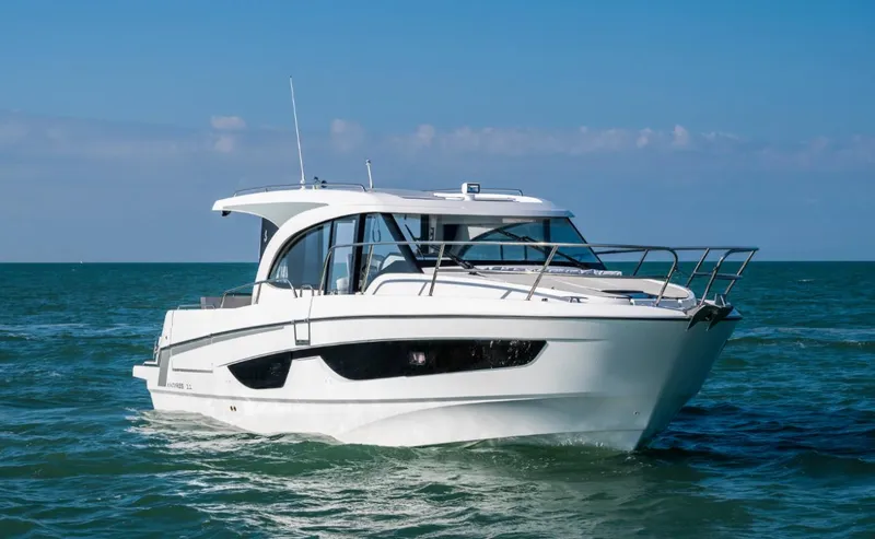 Slide: The Image of 2025 Beneteau Antares 11 cruising on open water under clear skies. - 9