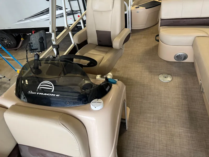 Slide: The Image of 2019 Sun Tracker Fishin' Barge 20 DLX interior with helm and seating area. - 10