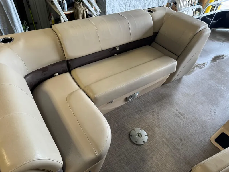 Slide: The Image of 2019 Sun Tracker Fishin' Barge 20 DLX interior seating, beige upholstery, spacious layout. - 15