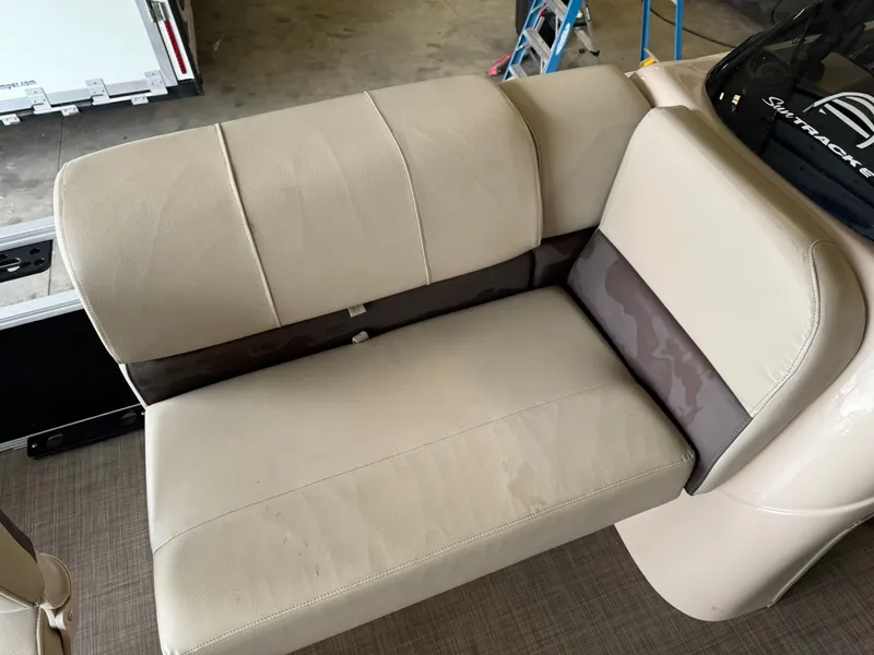 Slide: The Image of 2019 Sun Tracker Fishin' Barge 20 DLX beige seating, close-up view. - 8