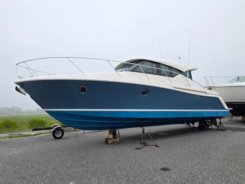 Slide: The Image of 2018 Tiara Yachts 39, blue hull, on stands, overcast day. - 0