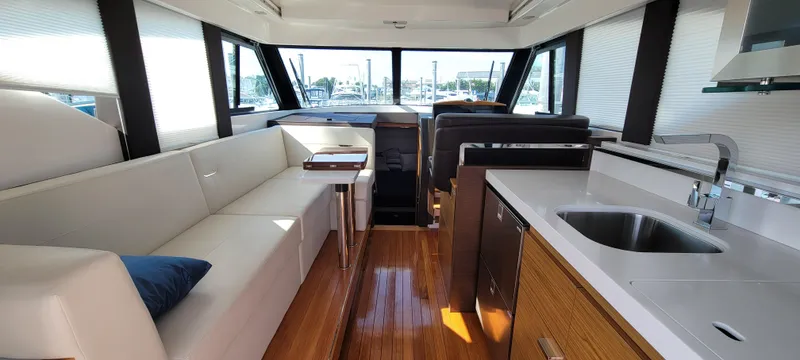 Slide: The Image of Luxurious interior of 2018 Tiara Yachts 39 with modern seating and kitchen area. - 10
