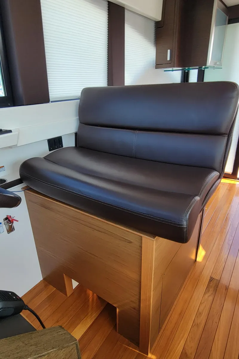 Slide: The Image of Luxurious leather seating in 2018 Tiara Yachts 39 interior with wooden flooring. - 14