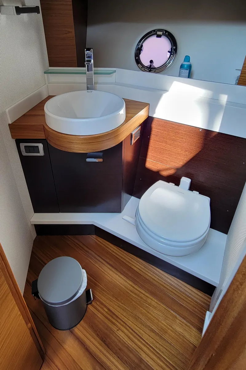 Slide: The Image of Modern bathroom in 2018 Tiara Yachts 39, featuring sleek sink and toilet design. - 15