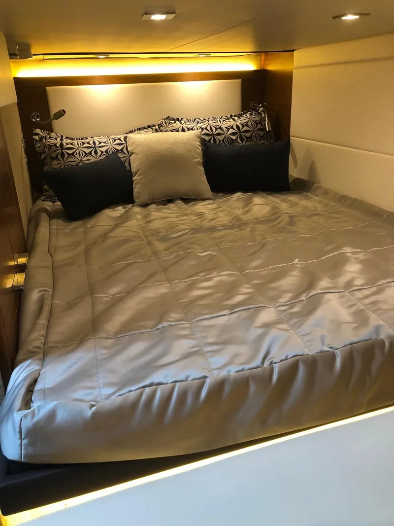 Slide: The Image of Luxurious bedroom interior of 2018 Tiara Yachts 39 with elegant bedding and ambient lighting. - 19