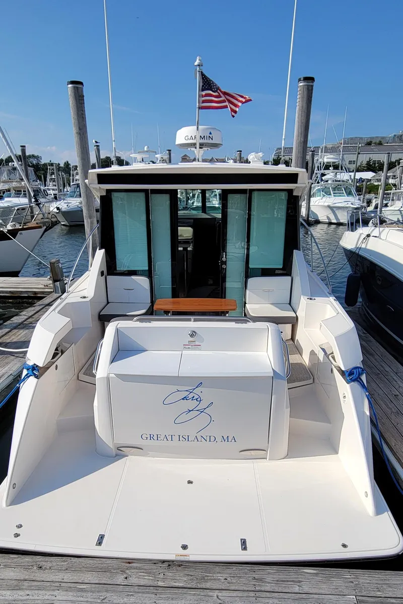 Slide: The Image of 2018 Tiara Yachts 39 docked, rear view with American flag, Great Island, MA. - 5